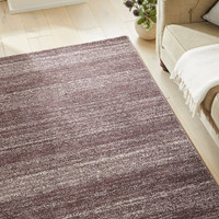 plum striped rug in a living room with matching decor