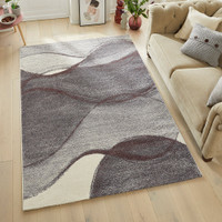 plum geometric rug in a living room with matching decor