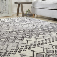 anthracite geometric rug in a living room with matching decor