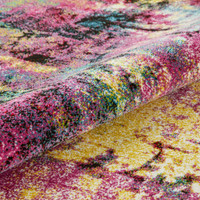 multicolour abstract rug closeup partially rolled