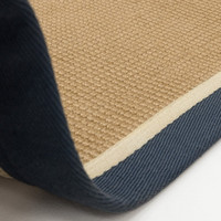 blue cream jute rug closeup on white floor