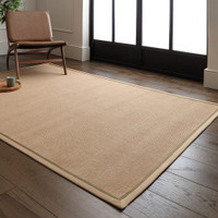 sage linen jute rug in a living room with matching decor