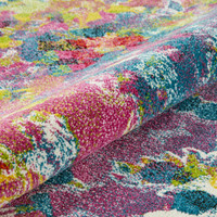 multicolour abstract rug closeup partially rolled