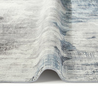 grey abstract rug closeup fold on white floor