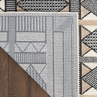 beige black geometric rug corner fold