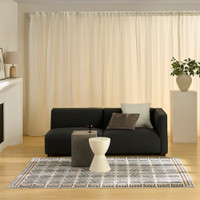 beige black geometric rug in a living room