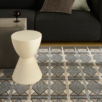 beige black geometric rug in a living room