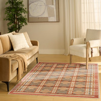 rust blue geometric rug in a living room