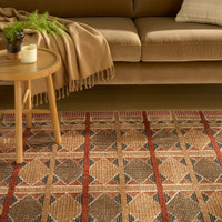 rust blue geometric rug in a living room