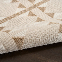 taupe geometric rug partially rolled