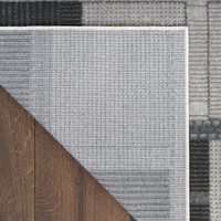 grey black geometric rug corner fold