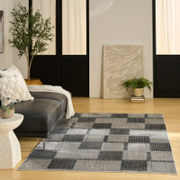 grey black geometric rug in a living room