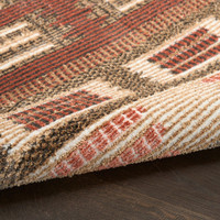 rust geometric rug partially rolled