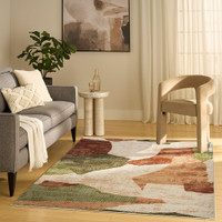 beige green burgundy geometric rug in a living room