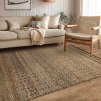 black beige flatweave rug in a living room with matching decor