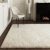 ivory shaggy rug in a living room with matching decor