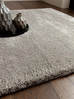 silver shaggy rug in a living room with matching decor
