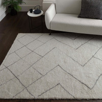 cream berber shaggy wool rug in a living room with matching decor