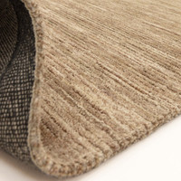 beige plain rug partial fold on white floor