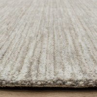 stone plain rug closeup edge on wood floor