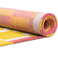 yellow chess eco rug rolled on white floor