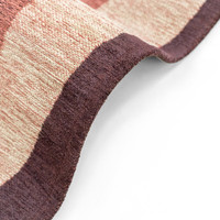 beige abstract eco rug closeup bend on white floor