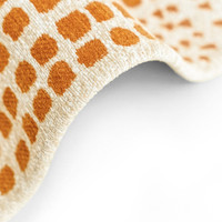 yellow abstract eco rug closeup fold on white floor