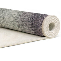 purple abstract rug rolled on white floor