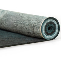 blue rug rolled on white floor