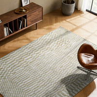 green abstract eco rug in a living room with matching decor