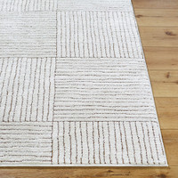 ivory brown scandi rug closeup corner on wood floor