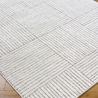 ivory brown scandi rug closeup corner on wood floor