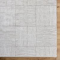 ivory brown scandi rug closeup corner on wood floor