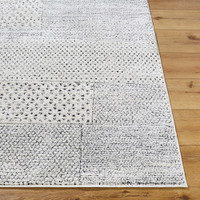 ivory scandi rug closeup corner on wood floor