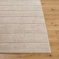 brown scandi rug closeup corner on wood floor