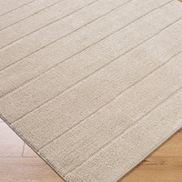 brown scandi rug closeup corner on wood floor