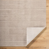 brown scandi rug corner fold on wood floor