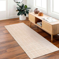 beige brown rug  in a room with matching decor