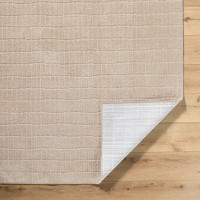 beige rug corner fold on wood floor