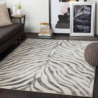 charcoal zebra pattern rug in a room with matching decor
