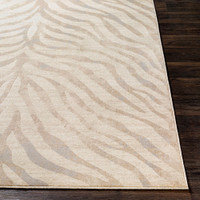 grey zebra pattern rug closeup corner on a wood floor