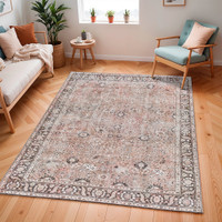brown traditional rug in a room with matching decor