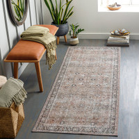brown traditional rug in a room with matching decor