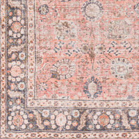 orange traditional rug closeup corner on wood floor