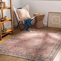 orange traditional rug in a room with matching decor