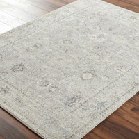 grey traditional rug in a room with matching decor