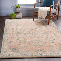 pink traditional rug in a room with matching decor