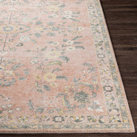 pink traditional rug closeup corner on wood floor