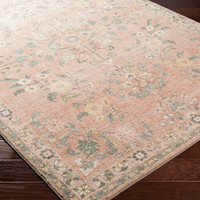 pink traditional rug closeup corner on wood floor