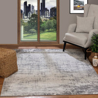 grey abstract rug in a room with matching decor